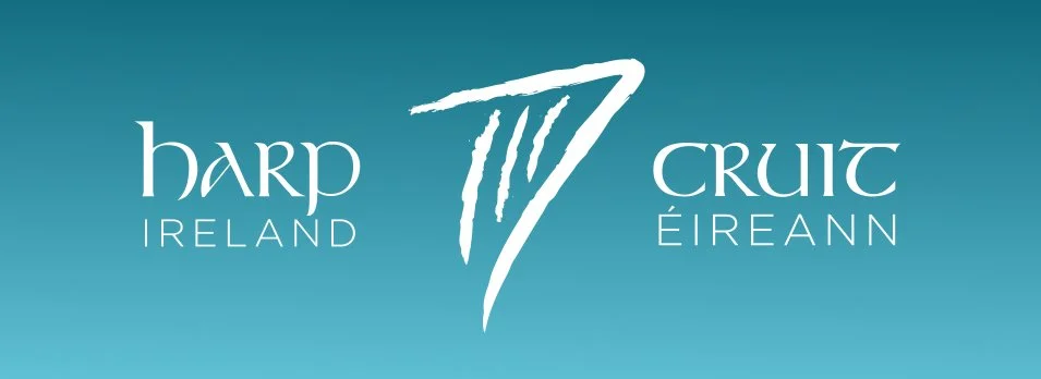Logo for Harp Ireland featuring a stylized harp and text in a blue background.