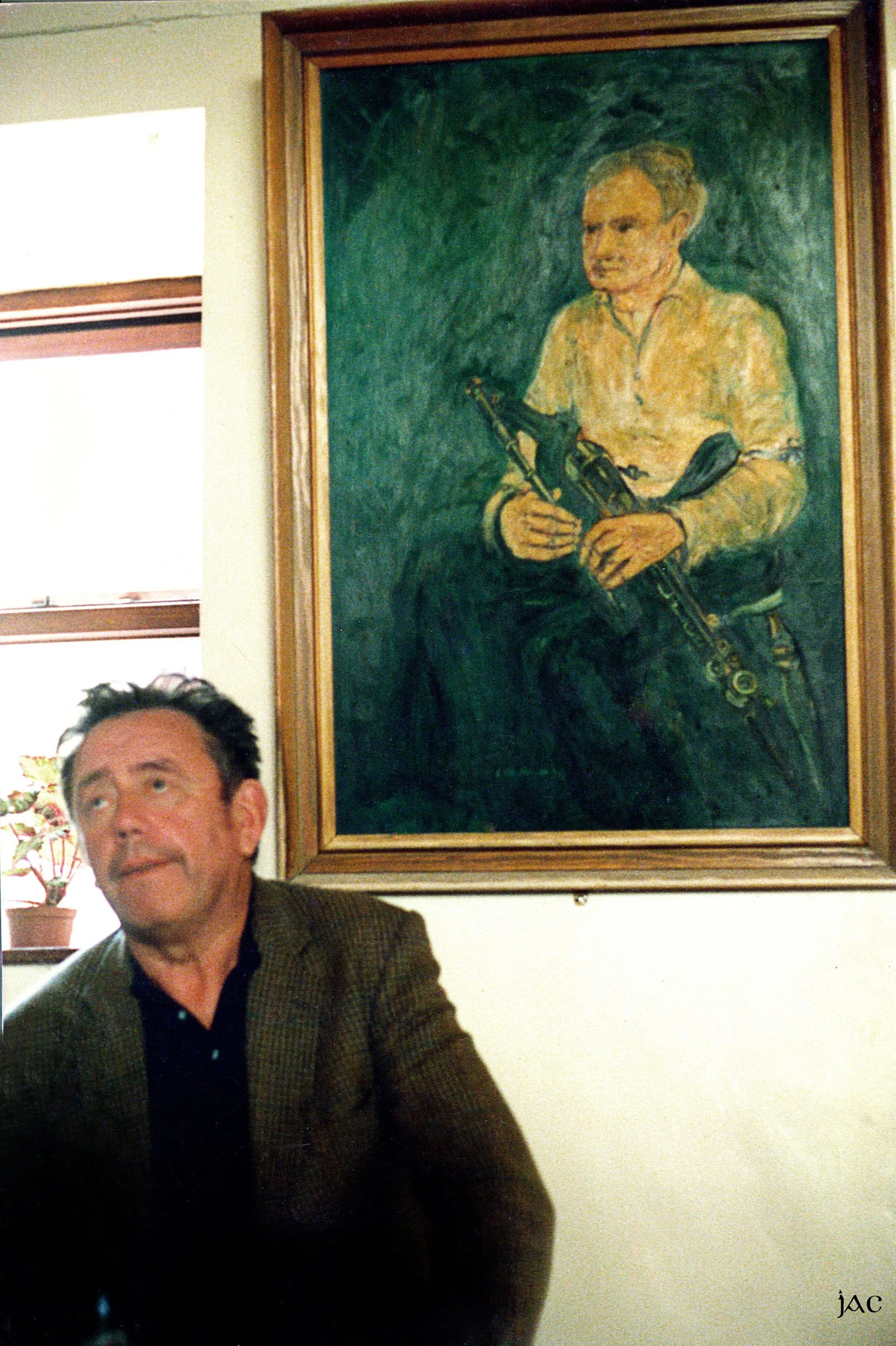 Marty O'Malley below a portrait of Willie Clancy.