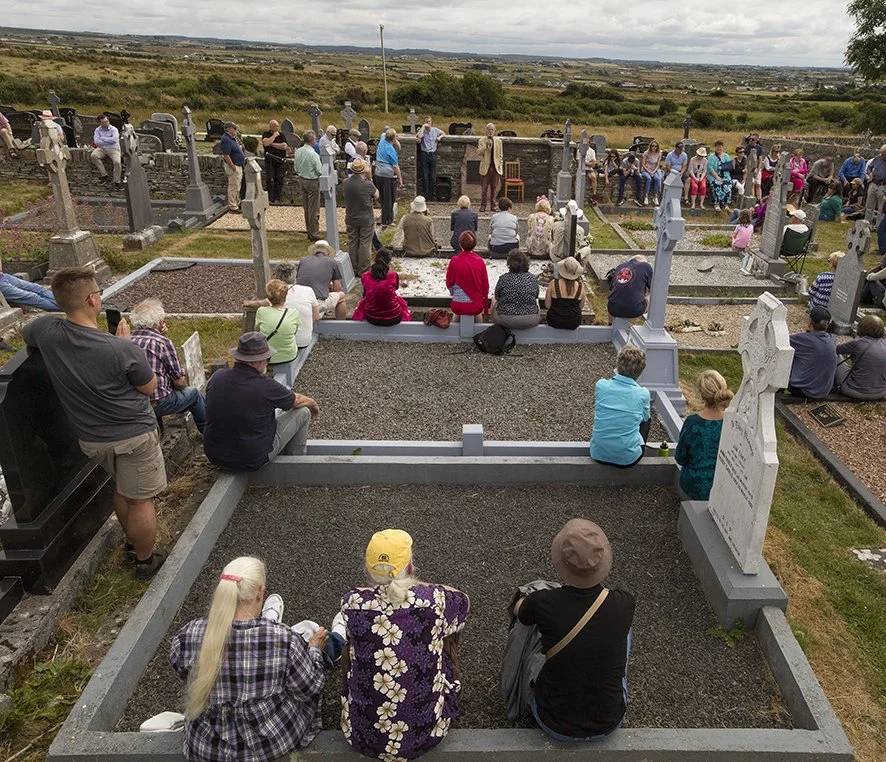 Séan Garvey (cream jacket) singing at the graveside tribute to Willie Clancy.