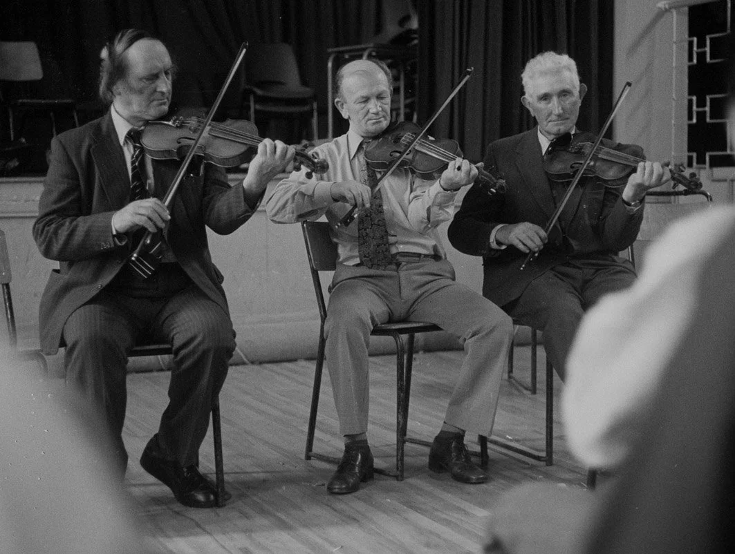John Kelly, Bobby Casey and Junior Crehan playing in the fiddle recital, 1977.