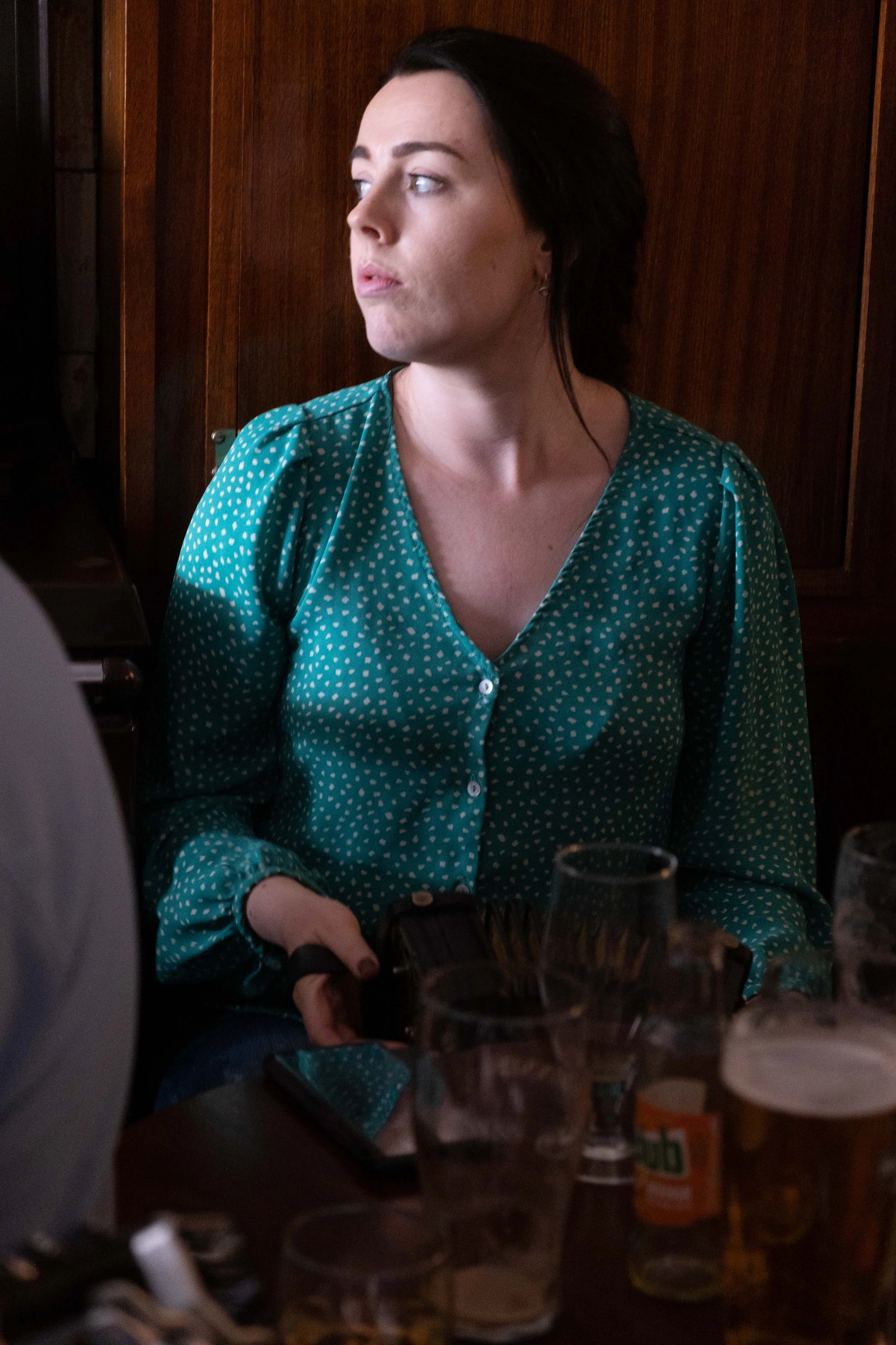 A concertina player in a session in Cleary's 2023.