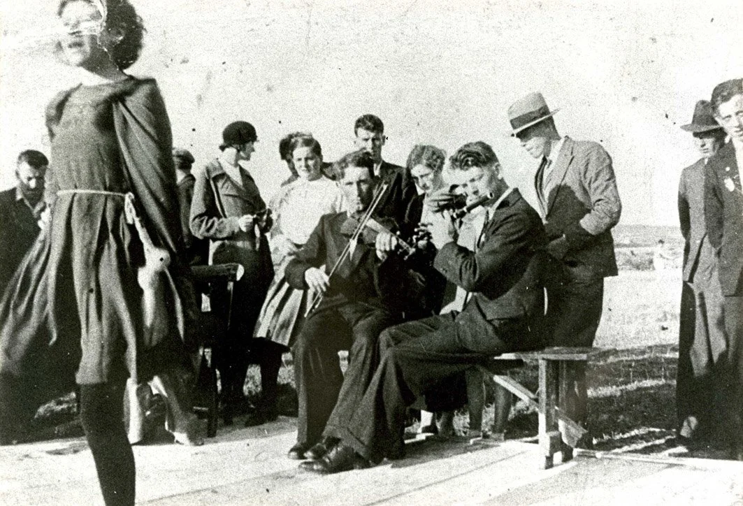 Junior Crehan (fiddle) and Josie Hayes (flute) playing at the Dunsallagh Feis, near Miltown Malbay, in the 1930s.