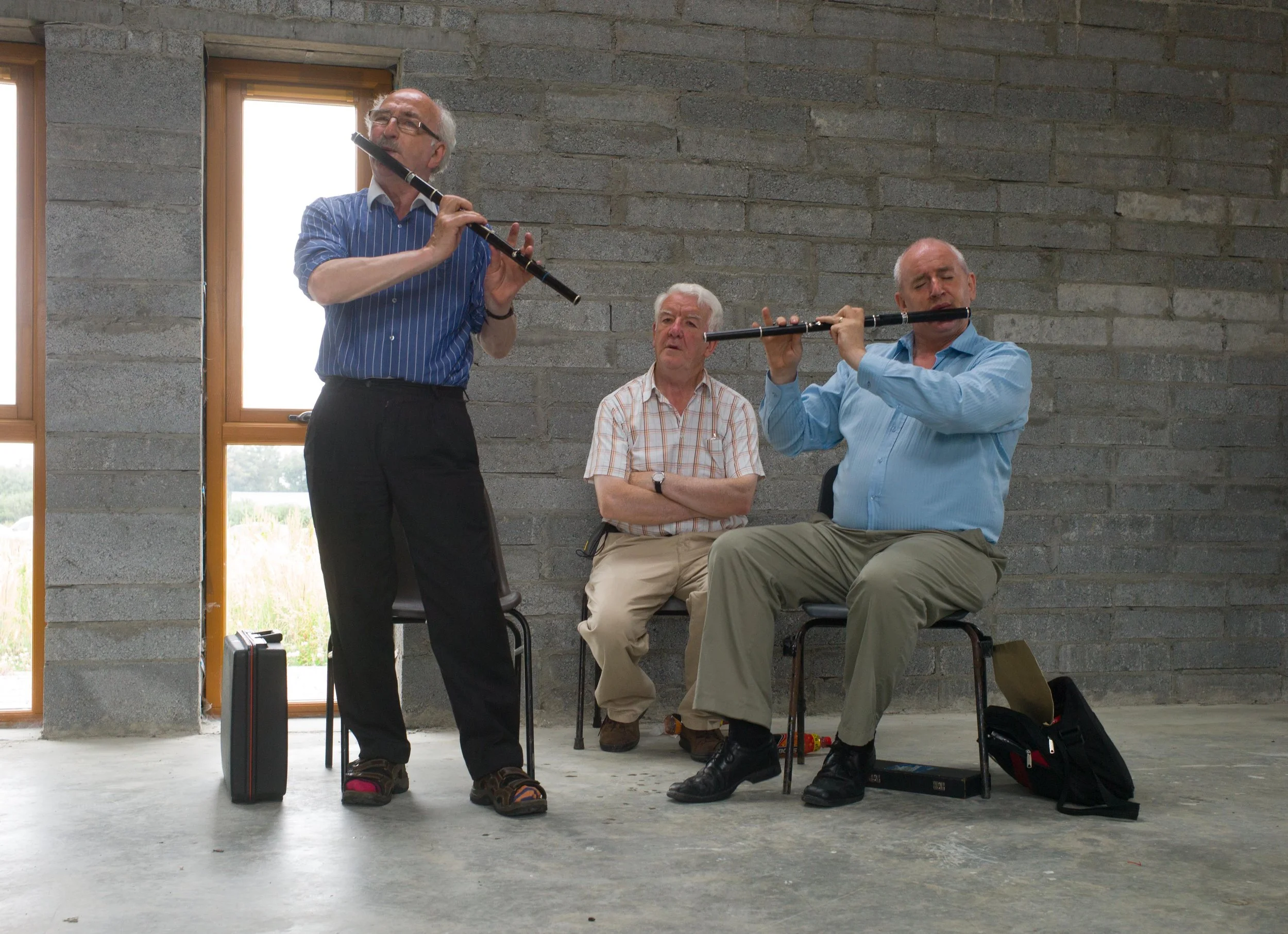 Cathal MacConnell and Marcas Ó Murchú playing for flute students 2013. Mick O'Connor is in the background.