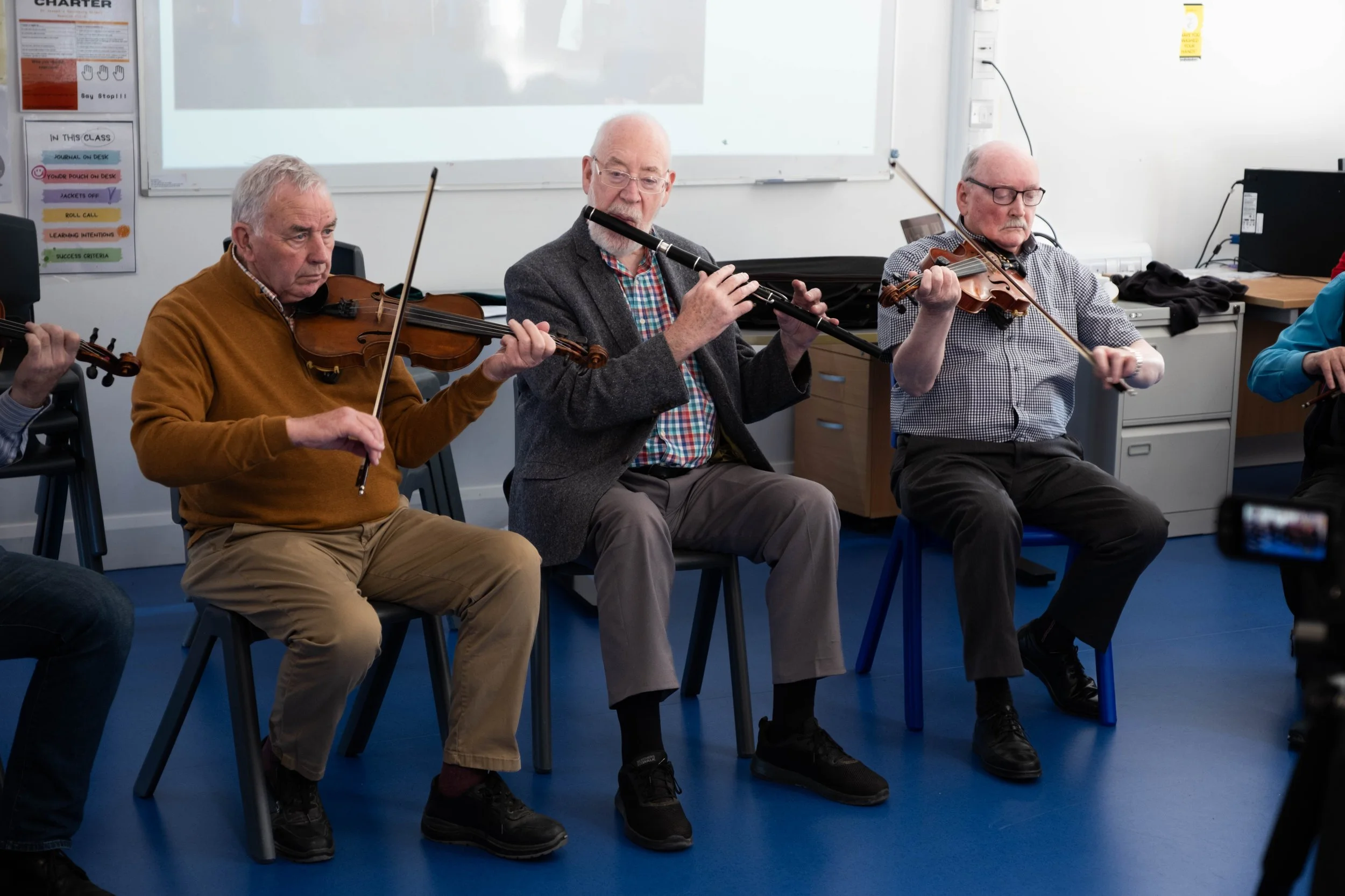 Connie O'Connell, Patsy Hanly and Pat Mullins in Máire O'Keeffe's master fiddler workshop 2024.