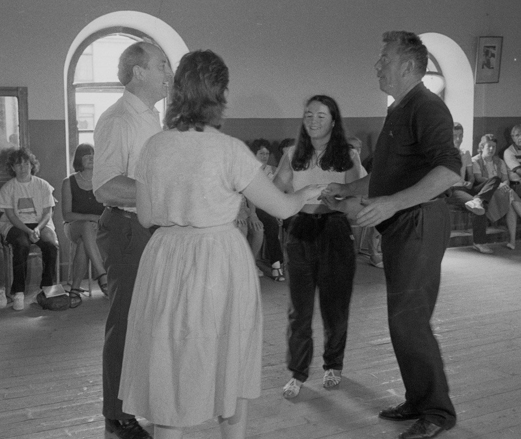 Marty O'Malley (right) and others demonstrating a set dance, 1985.
