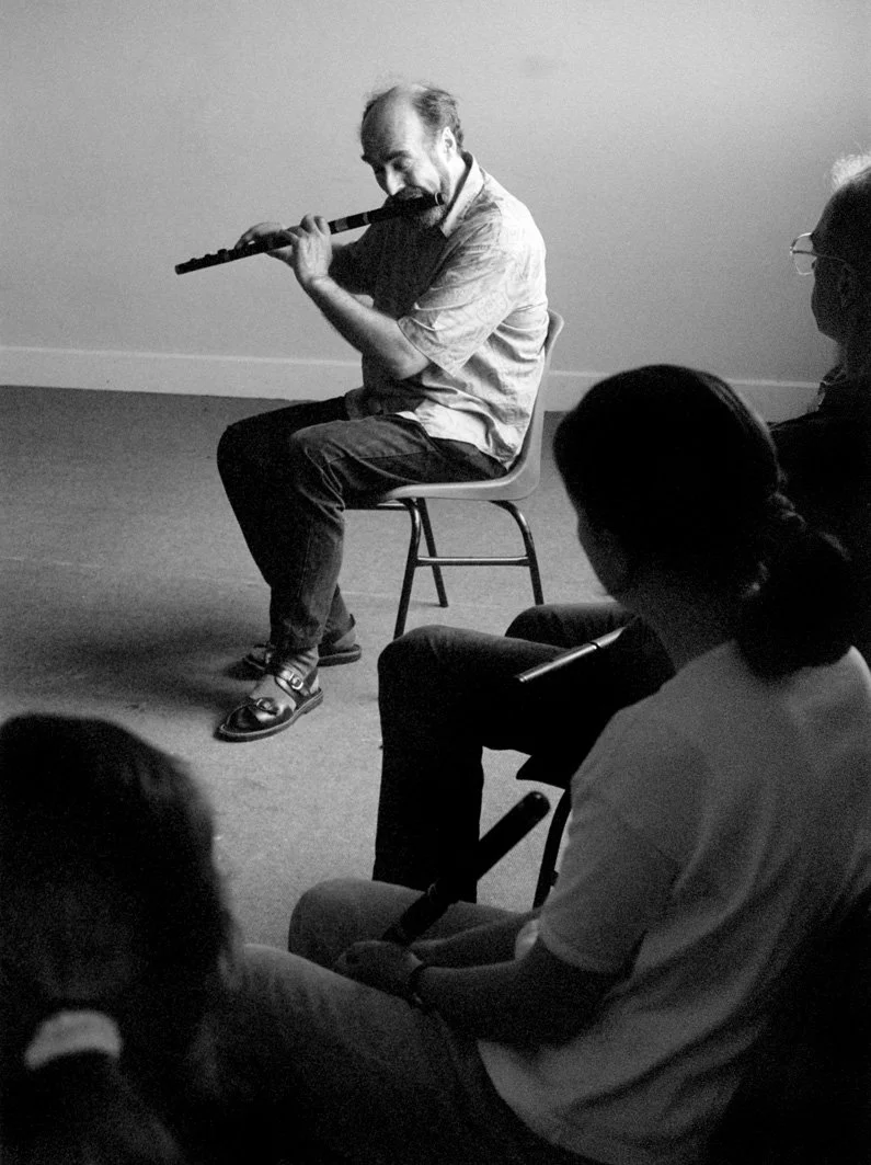 Fintan Vallely demonstrates a tune for his flute students, 1999.