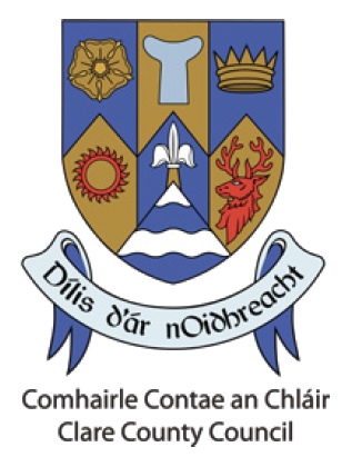 The Clare County Council coat of arms featuring various symbols and a banner with the Irish motto.