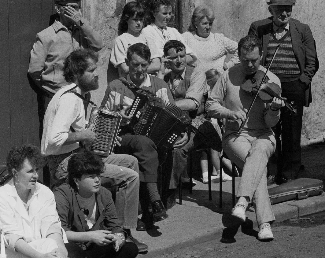 Jackie Daly, Johnny O'Leary and Manus Maguire playing for set dancers, 1986.