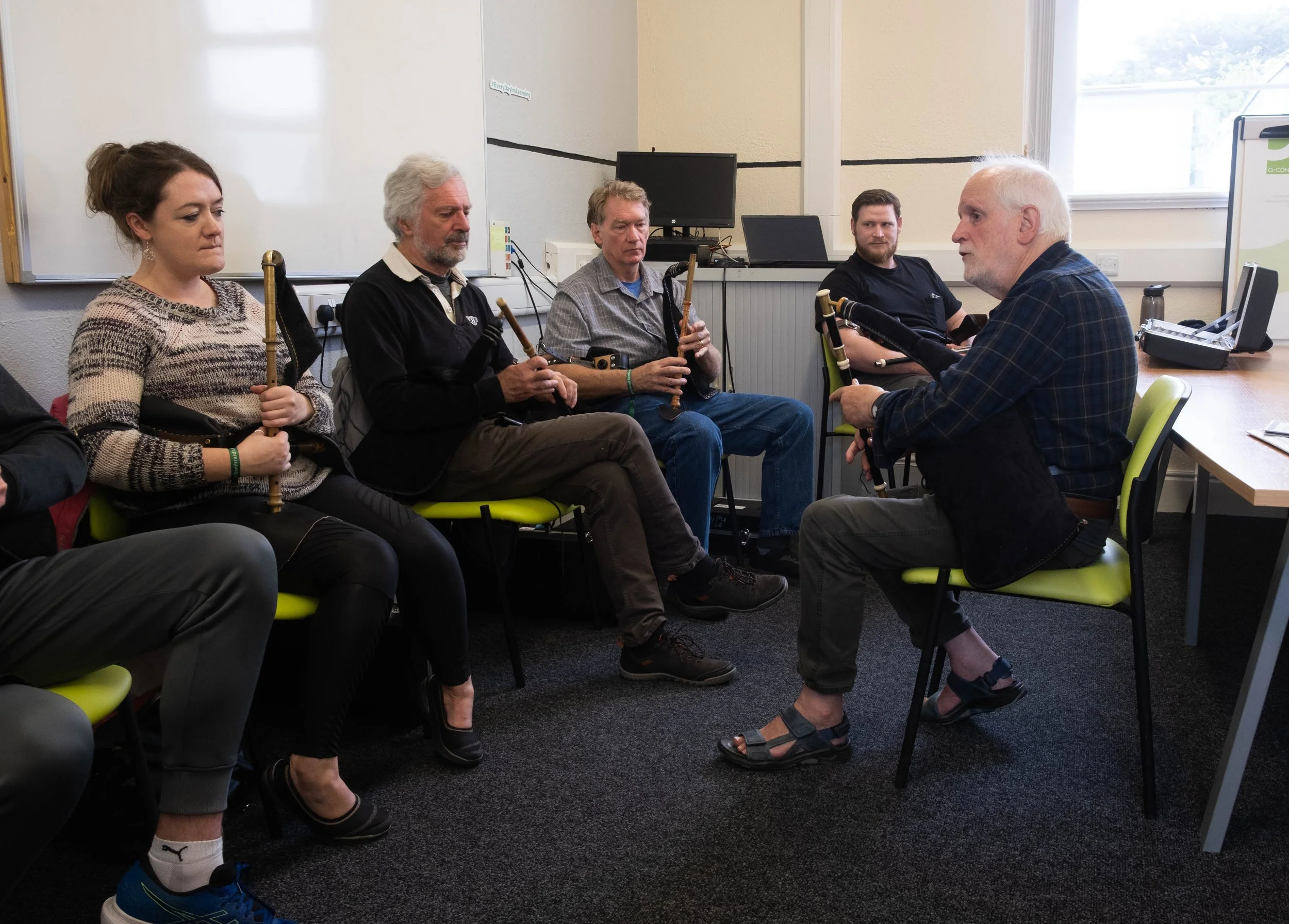 Tom Clarke (right) with his uilleann pipes students 2022.