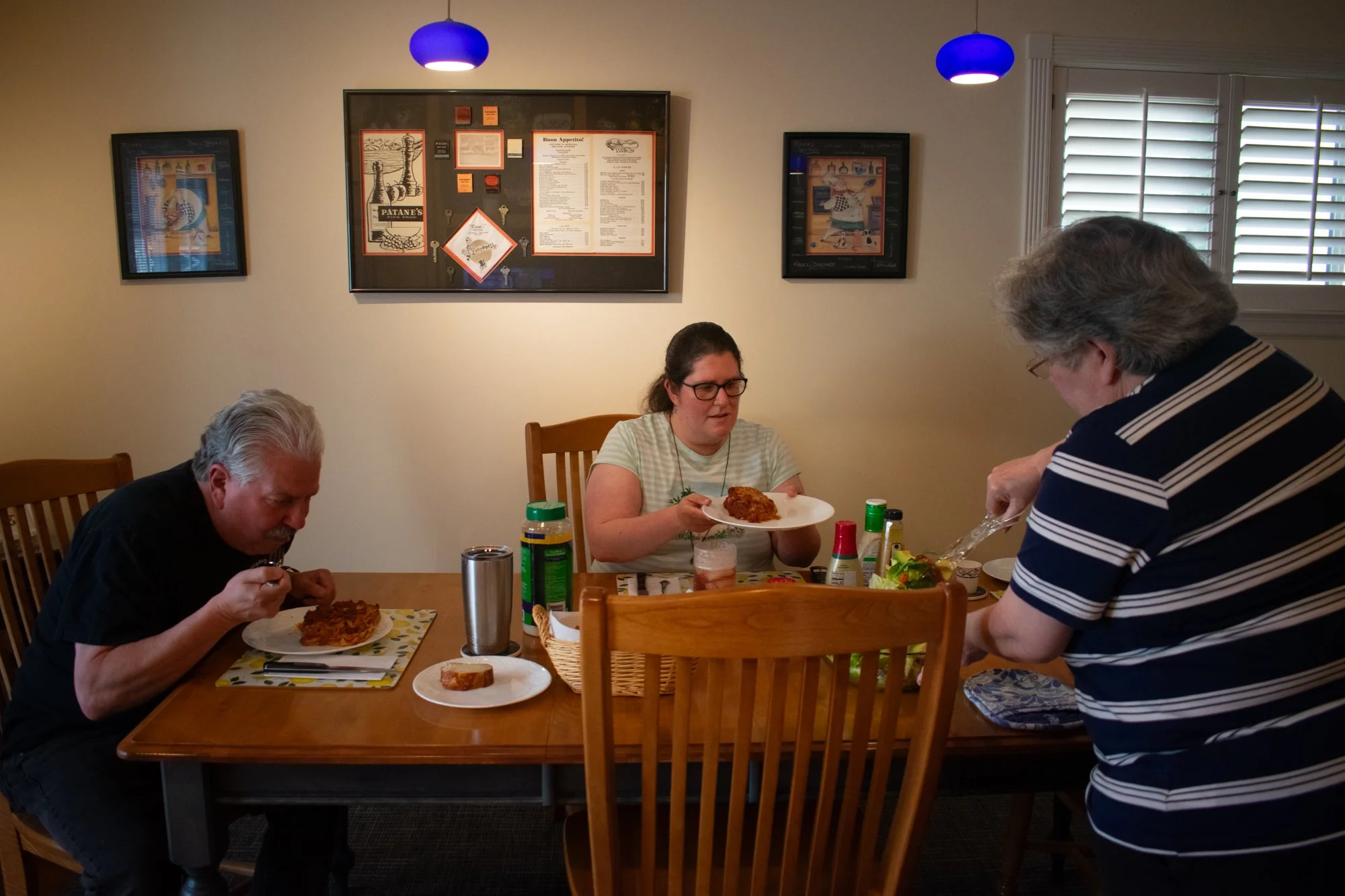 Marge serves Leo and Andrea lasagna on Tuesday, June 3. They have family dinners every night and watch “The Simpsons” or “Frasier.” Marge said family feels like home, and feels like she can do anything when they are by her side.
“We love her very m