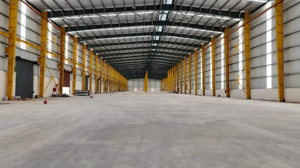 Industrial HVAC installation within a large warehouse space designed to provide efficient temperature control and airflow.