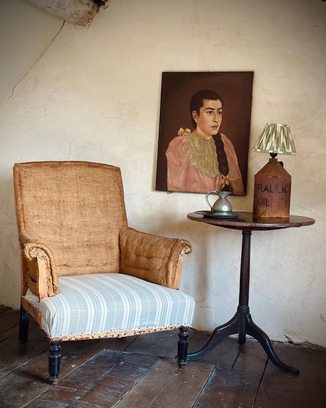 There&rsquo;s something quietly magical about a chair that has already lived a life.

This 19th-century French scroll-back armchair carries that kind of beauty &mdash; graceful curves, a beautifully timeworn wooden frame, and natural hessian upholste