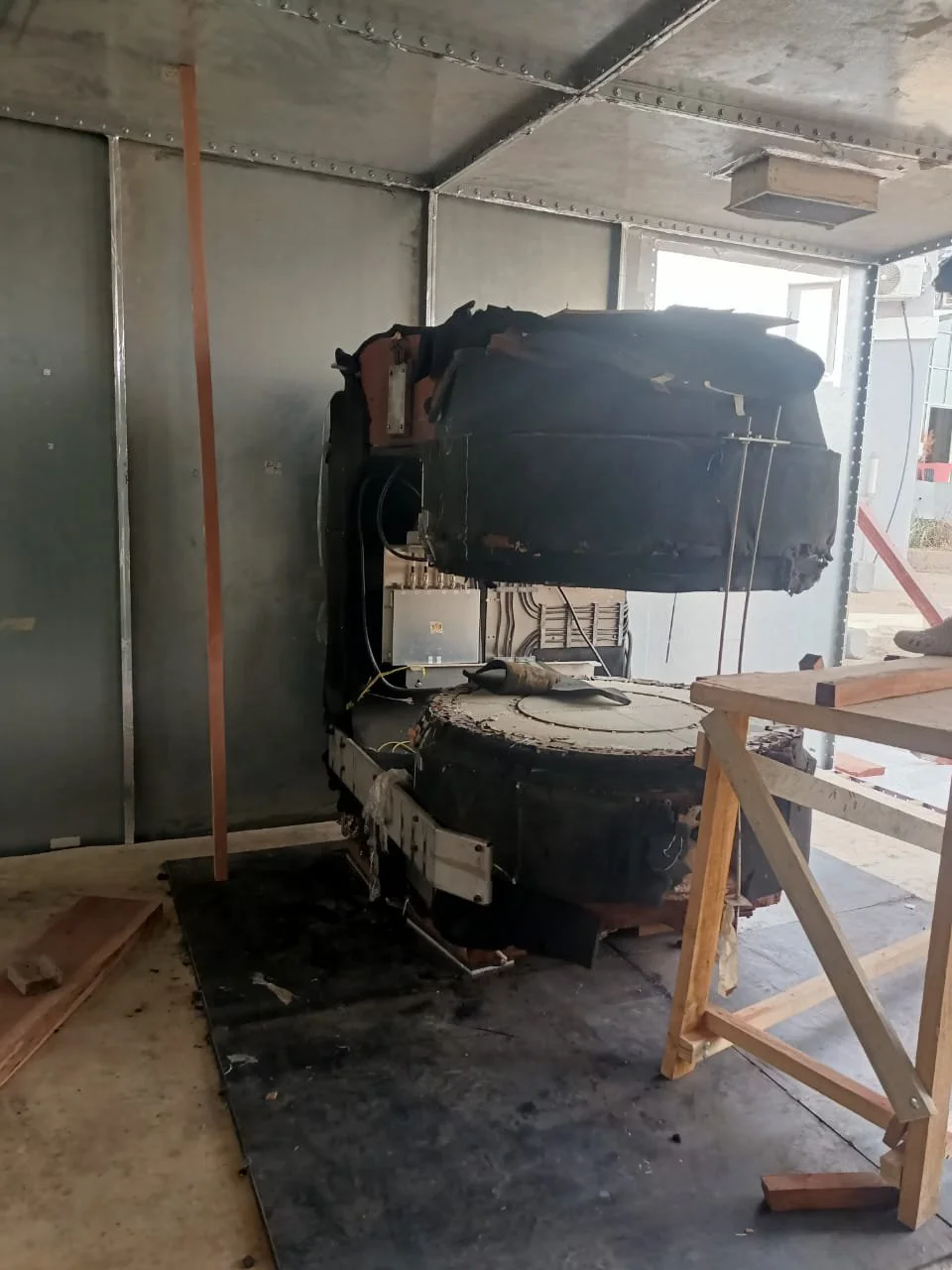 Open MRI magnet positioned inside the RF shielded room on a steel floor plate