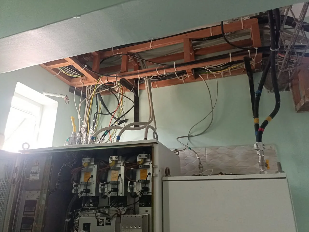 MRI equipment room with electronics cabinets and cable trays