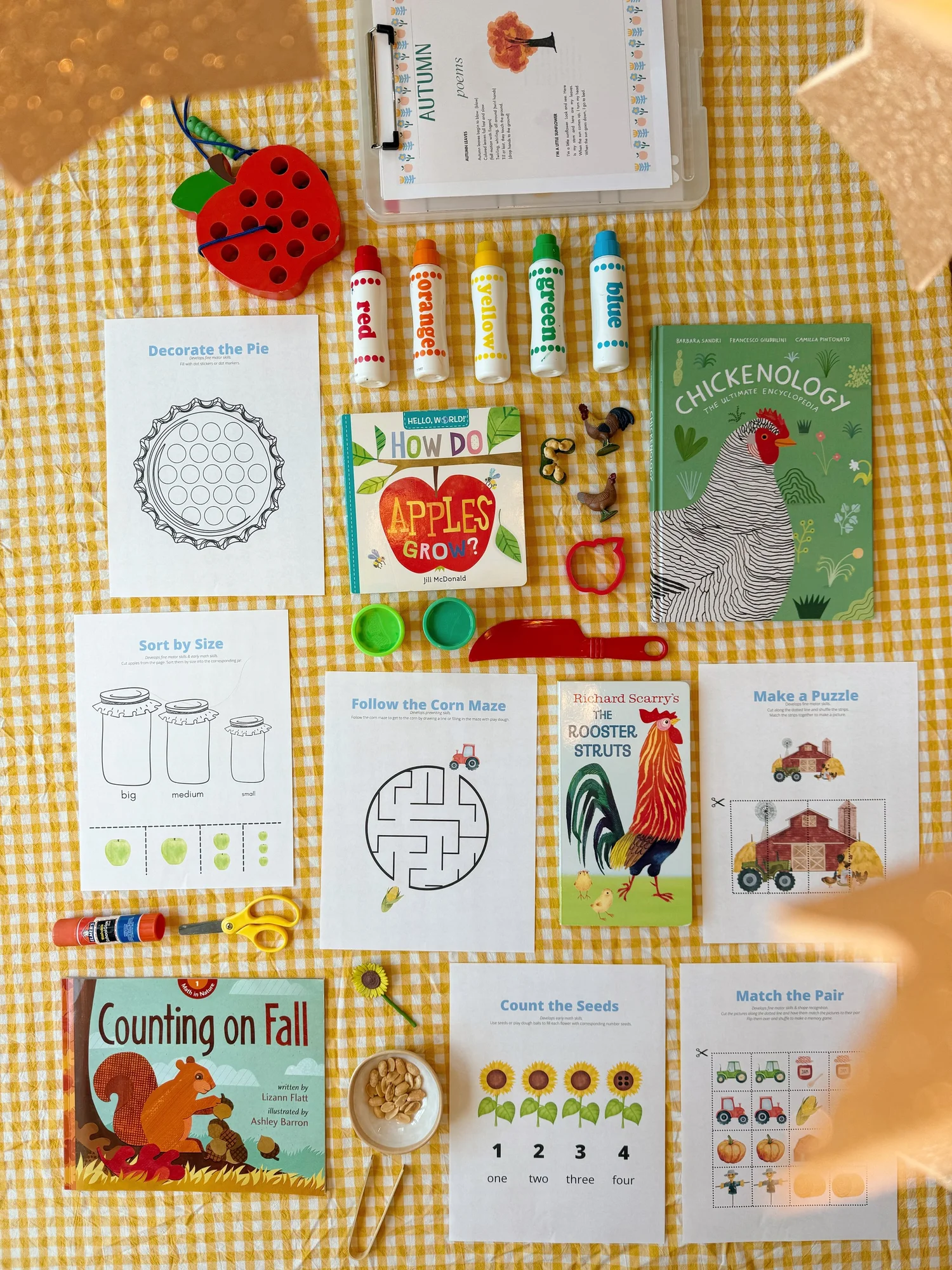 Fall morning basket activities laid out on the table with picture books and activity pages
