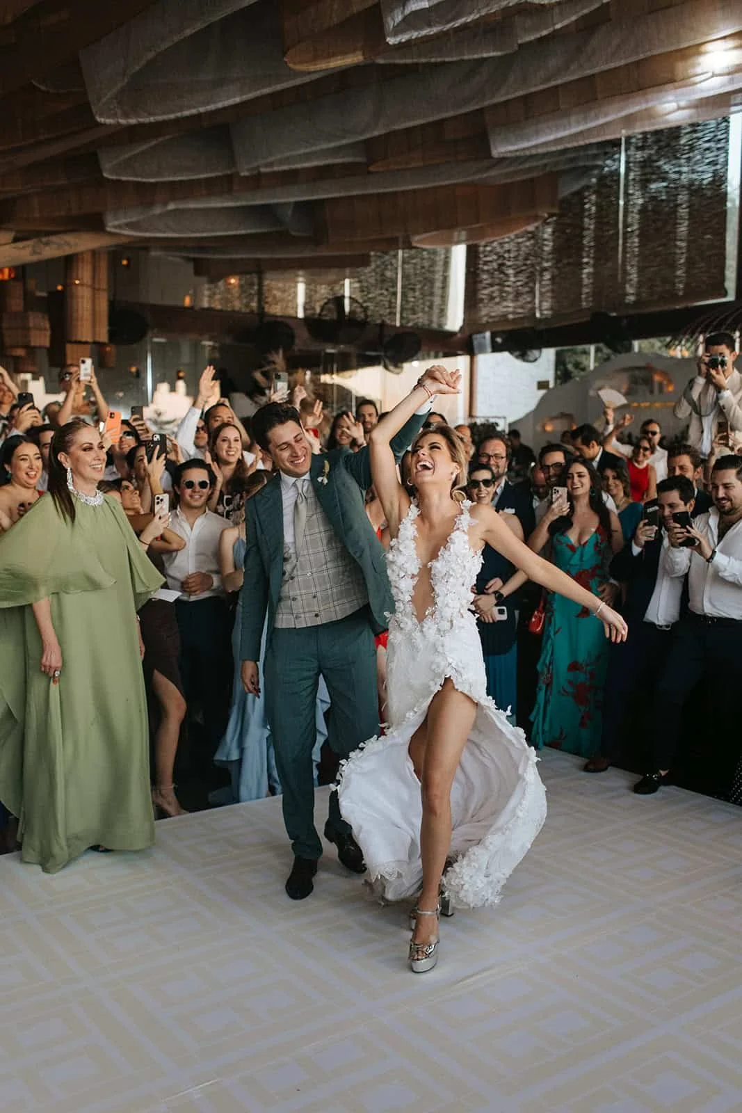 Destination wedding reception party in Riviera Maya with bride and groom dancing