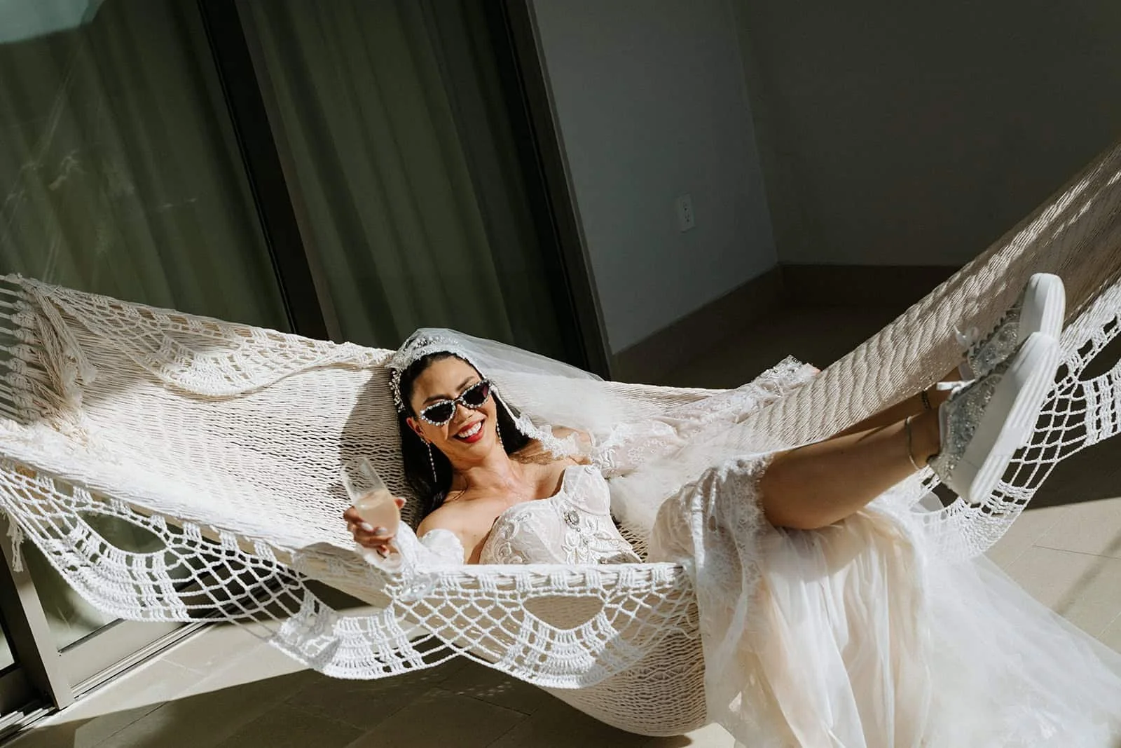 garza-blanca-cancun-bride-hammock-champagne.jpg