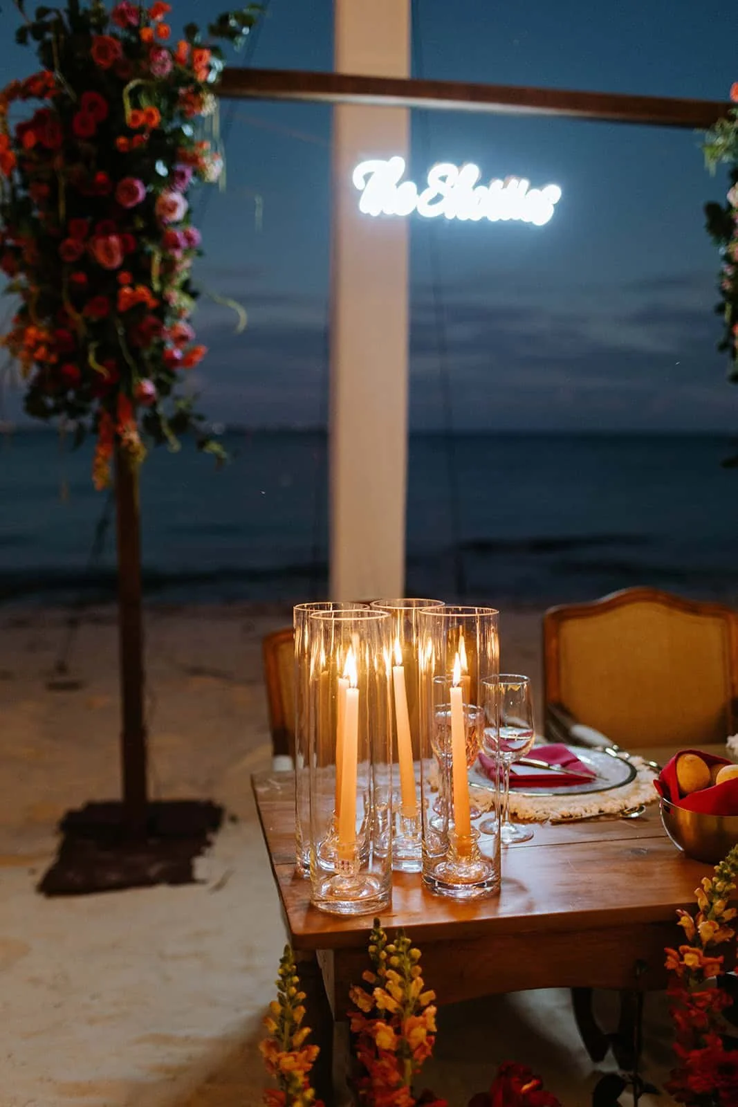 garza-blanca-cancun-wedding-sweetheart-table-candles-night.jpg