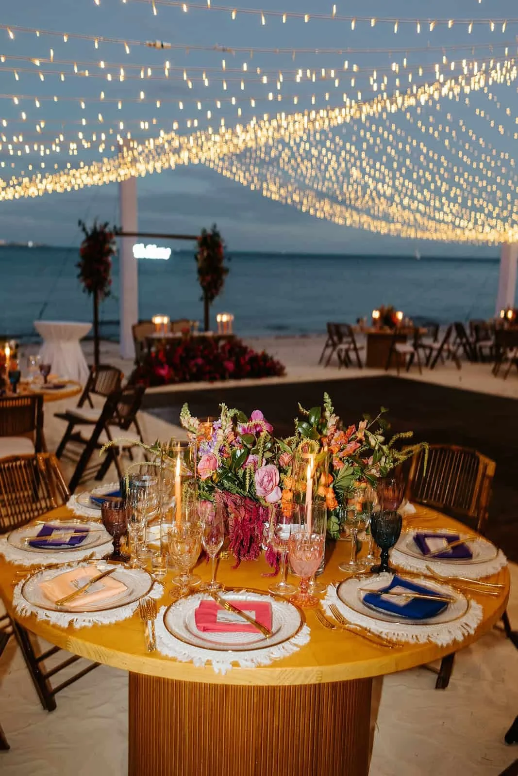 garza-blanca-cancun-wedding-reception-tablescape-string-lights.jpg