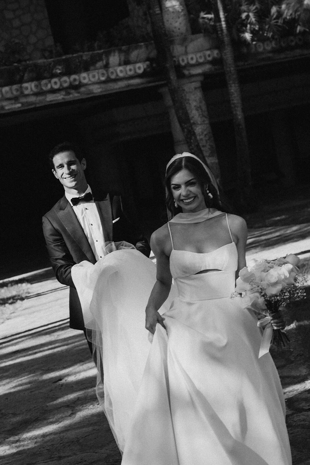 Bride and groom walking together during wedding in Riviera Maya Mexico
