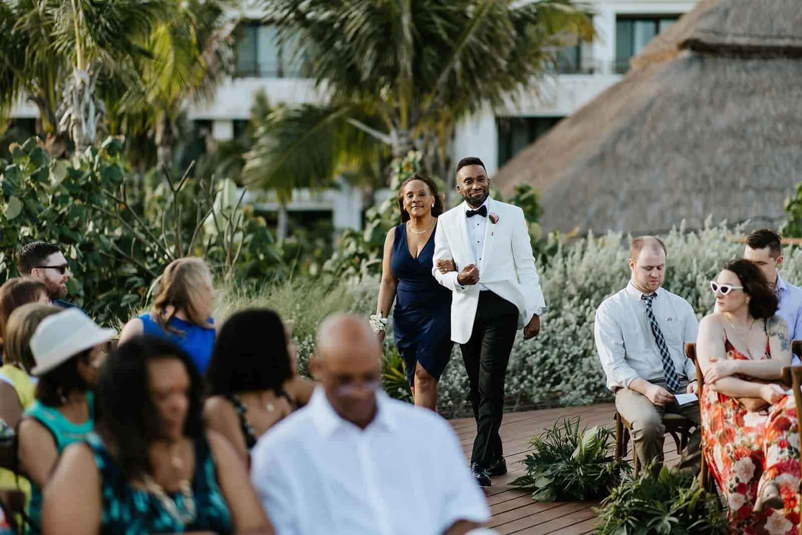 The Groom Walks the Aisle with His Mother