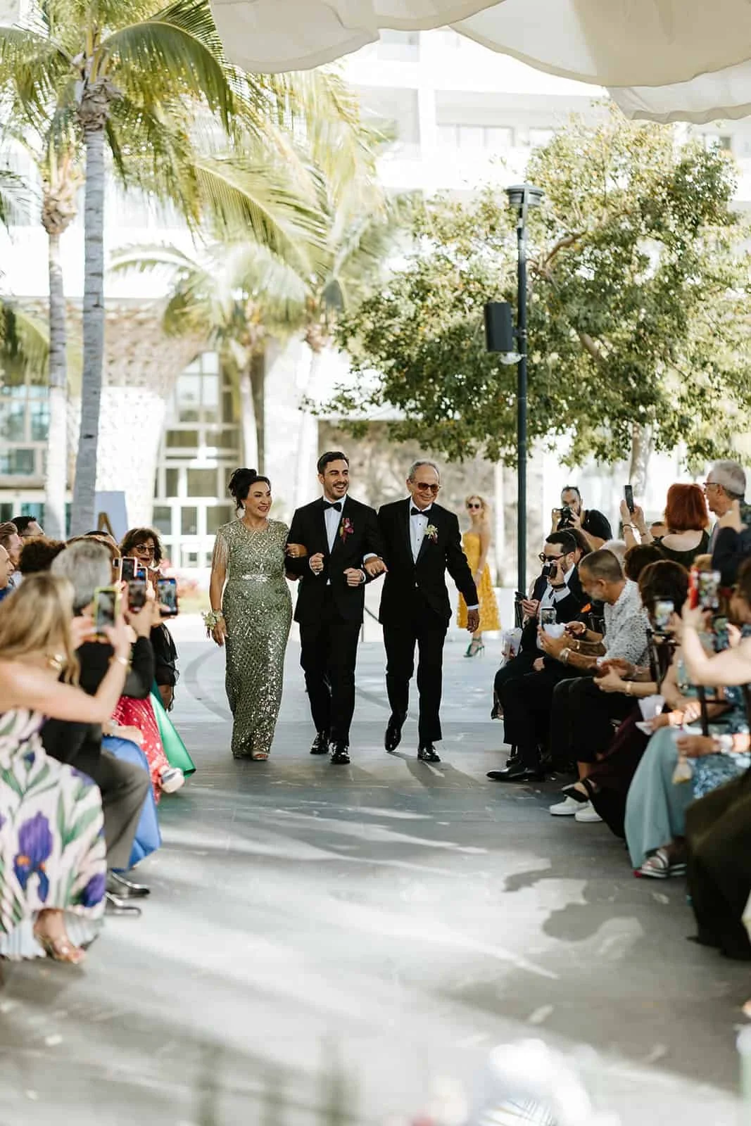 garza-blanca-cancun-wedding-groom-processional-parents.jpg