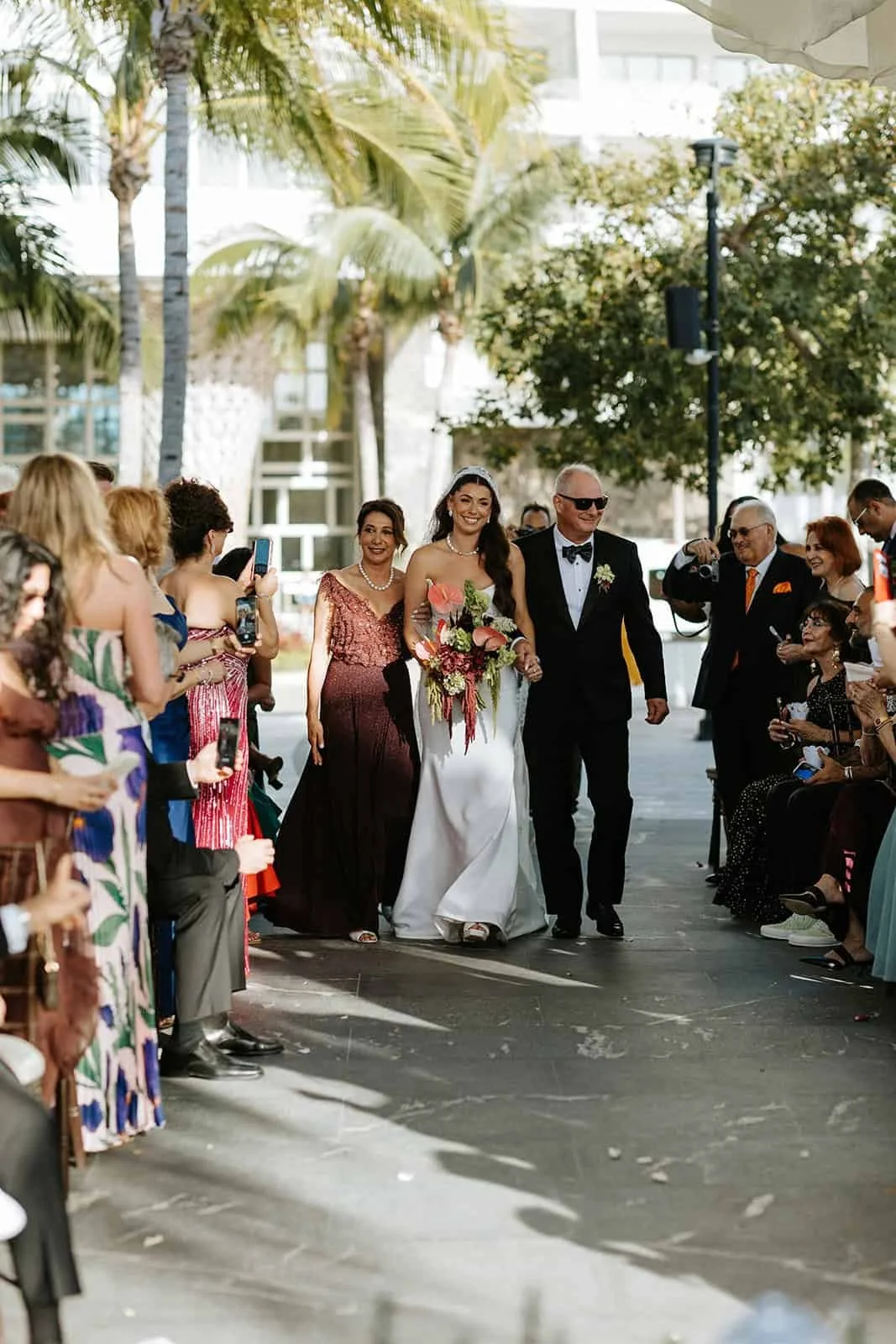 garza-blanca-cancun-wedding-bride-processional-parents.jpg