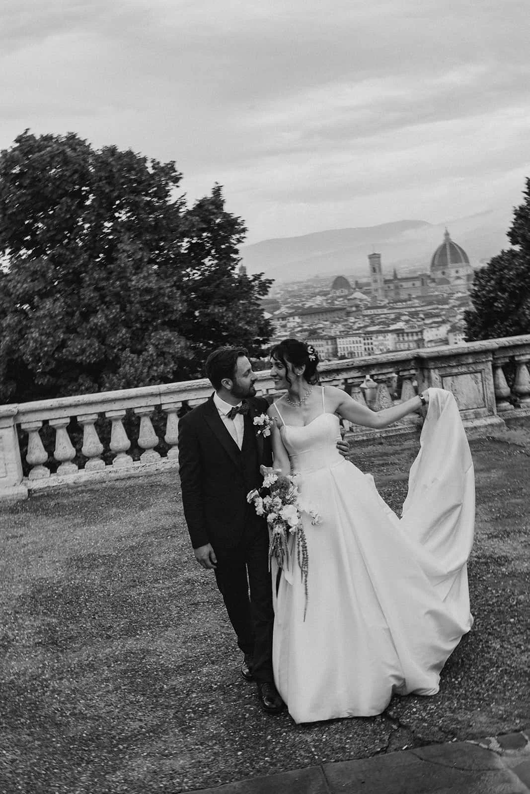 Matilde and Marco on a Florence terrace overlooking the Duomo during their wedding ceremony at Chiesa Ognissanti