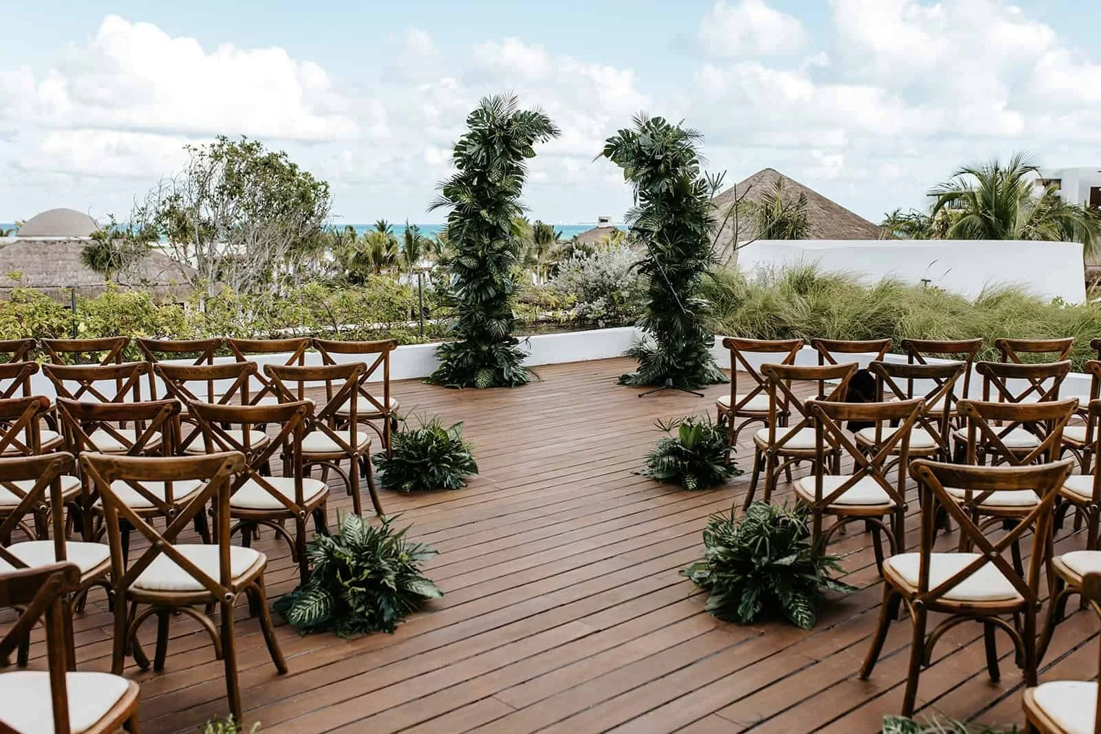 Wedding ceremony setup on the Portofino Rooftop with ocean views at Secrets Playa Blanca Costa Mujeres