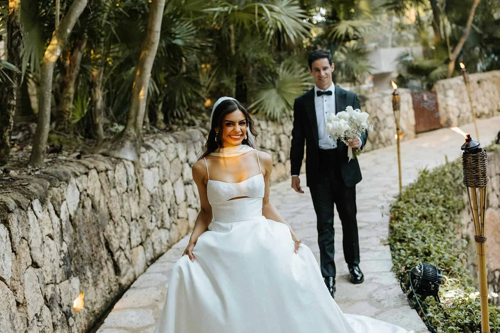 xcaret-park-wedding-couple-torchlit-path.jpg