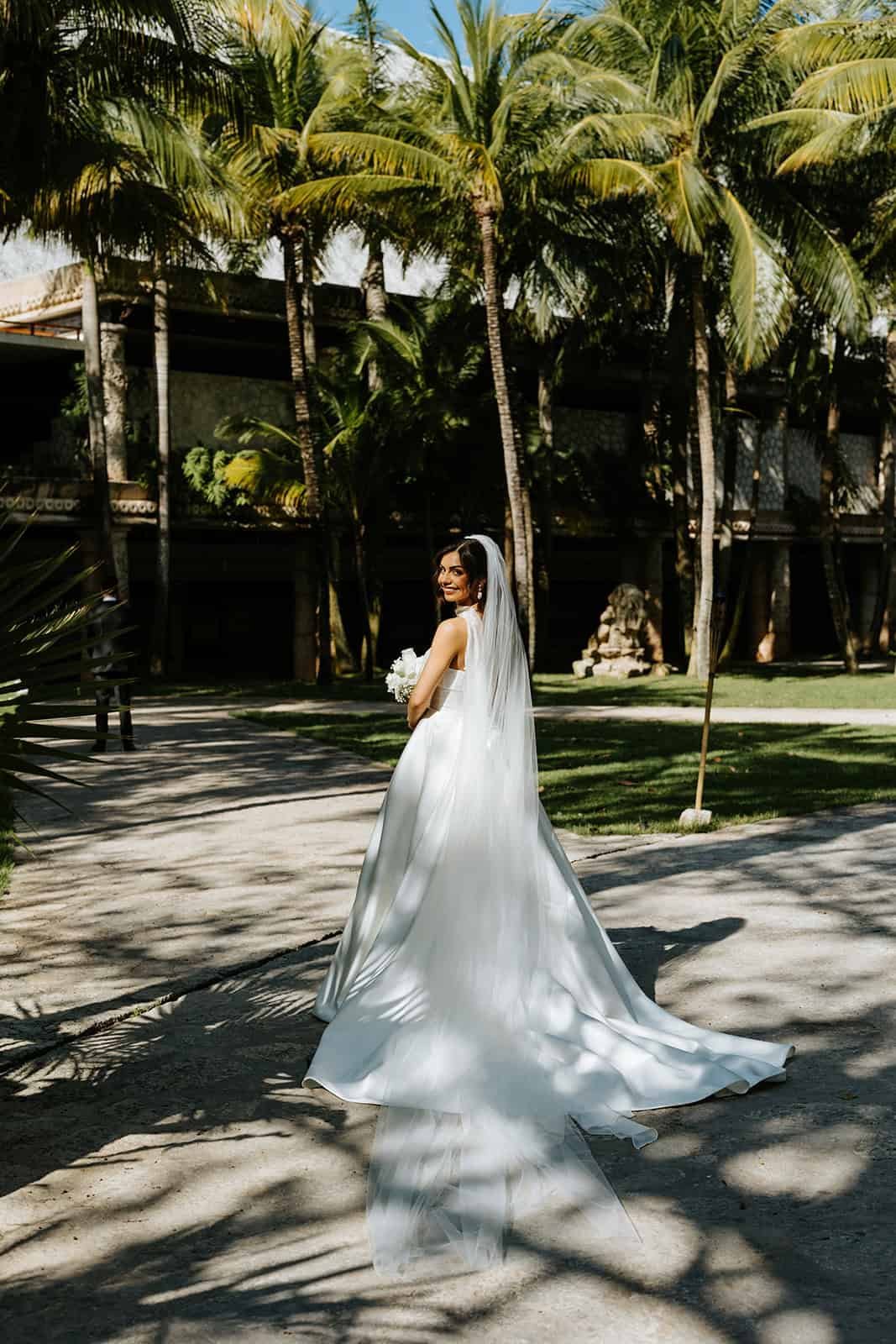 xcaret-park-bride-veil-palms-portrait.jpg