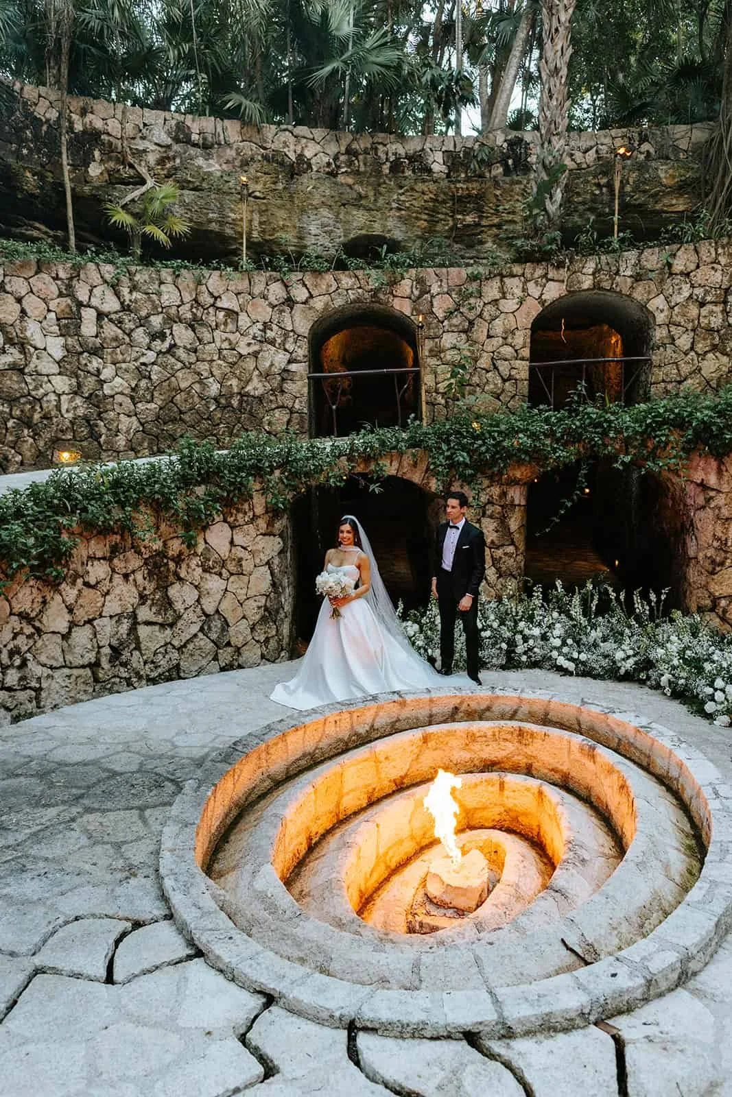 xcaret-park-caracol-wedding-couple-fire-pit-portrait.jpg