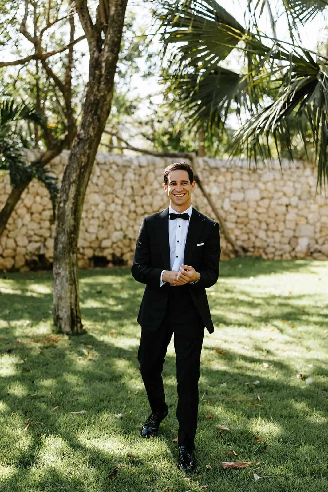 xcaret-park-groom-tuxedo-garden-portrait.jpg