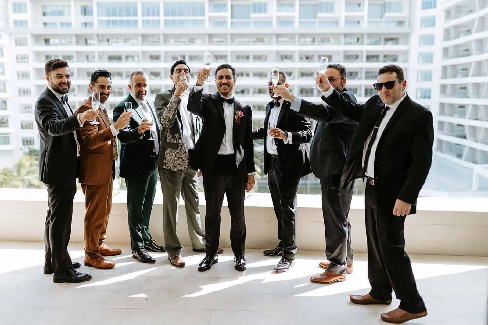 cancun-wedding-photographer-groomsmen-champagne-toast.jpg