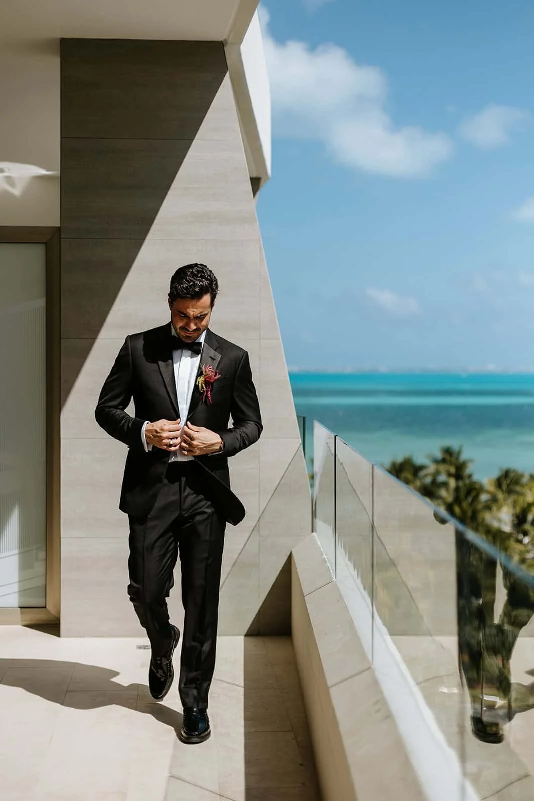 cancun-groom-tuxedo-ocean-view-balcony.jpg