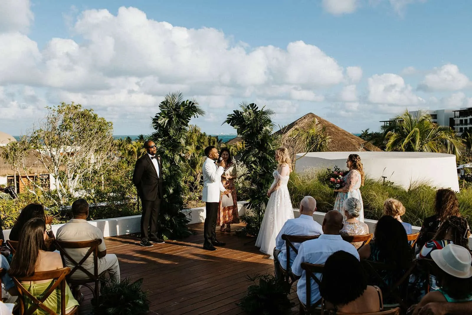 Destination wedding ceremony at Secrets Playa Blanca rooftop terrace in Costa Mujeres Cancun