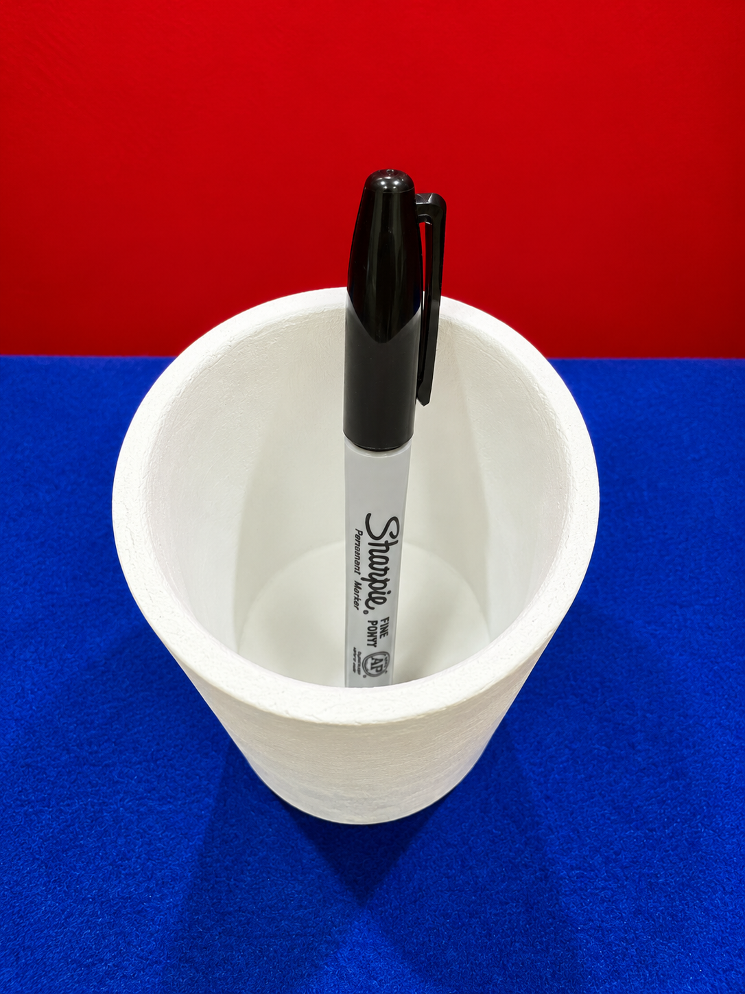 Sharpie in a Textured White Cup.png
