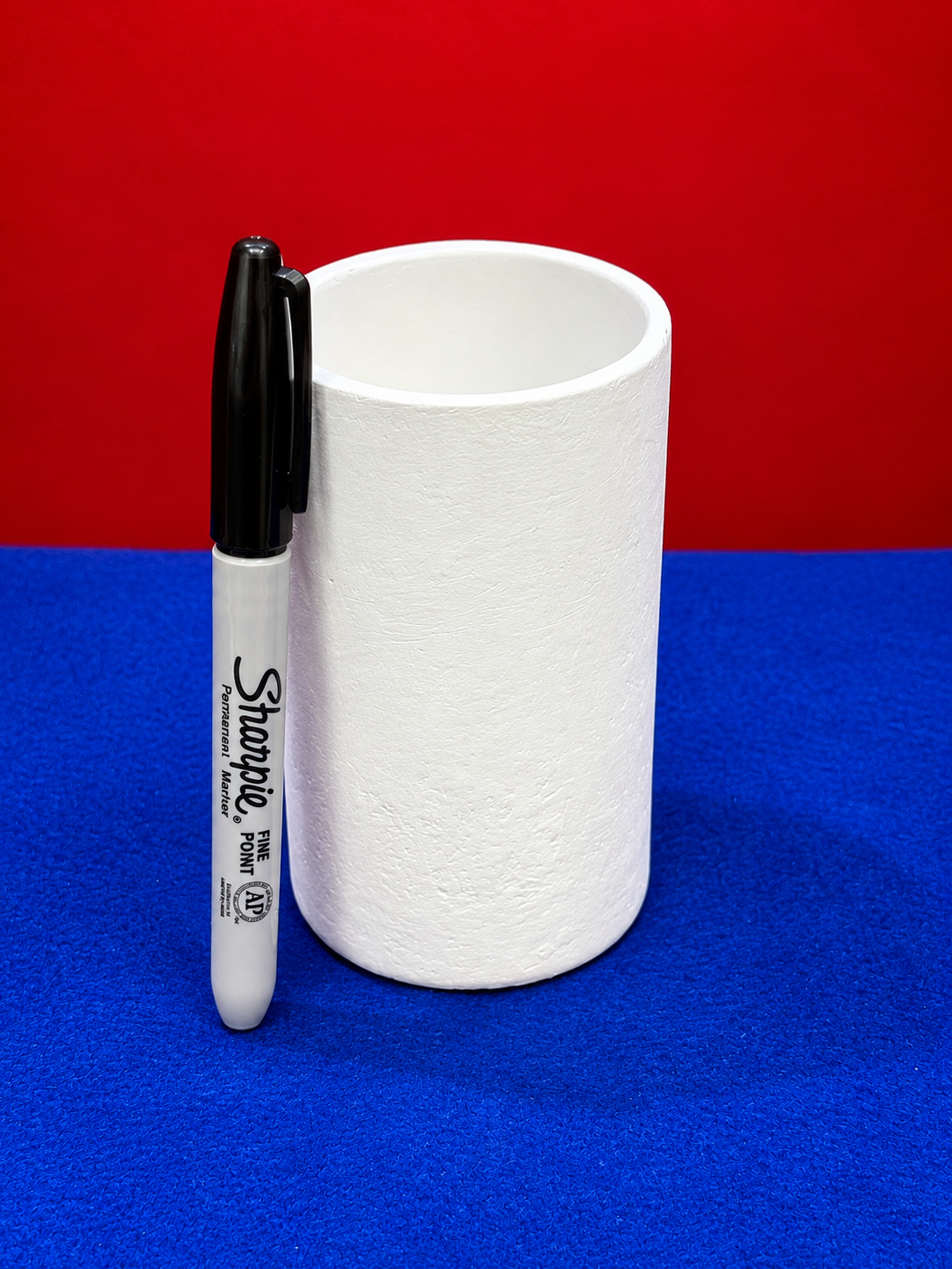 Plaster Cup and Sharpie on Blue.png