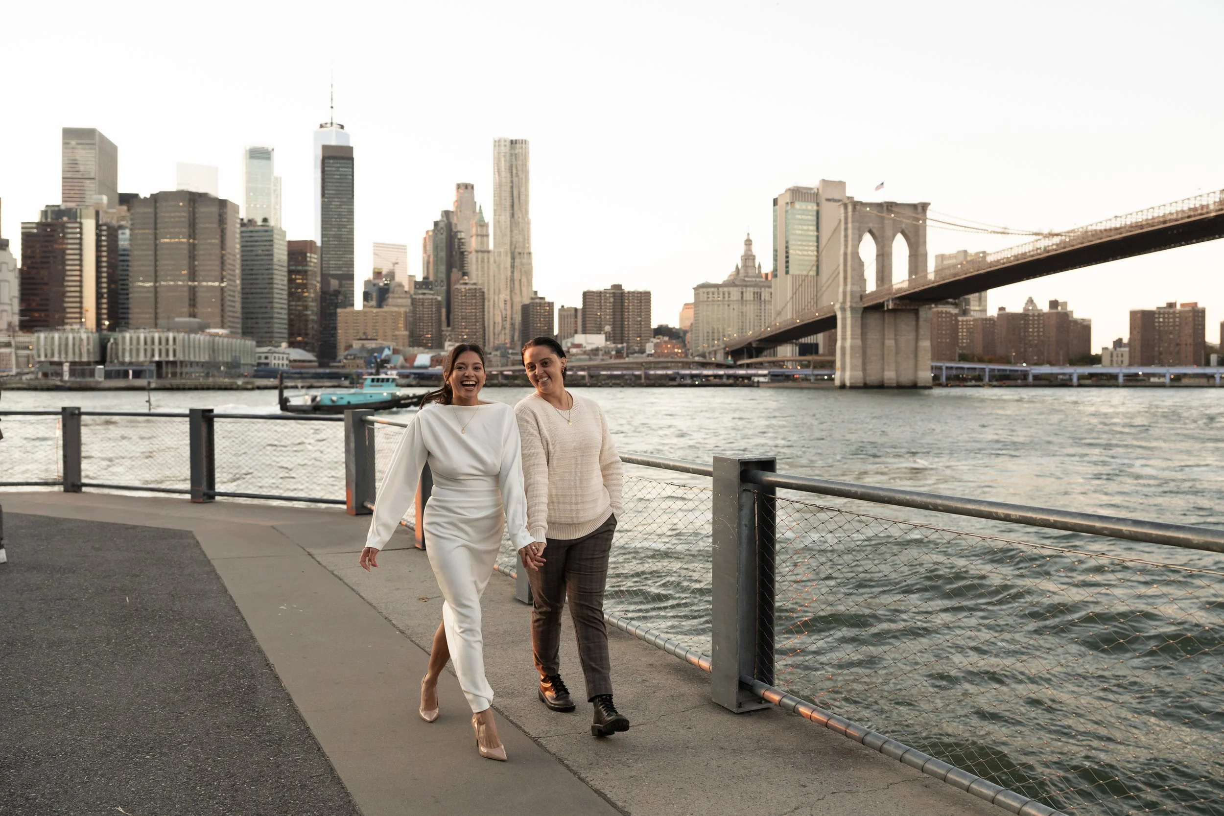 Woman's hand with engagement ring on man's shoulder, intimate embrace