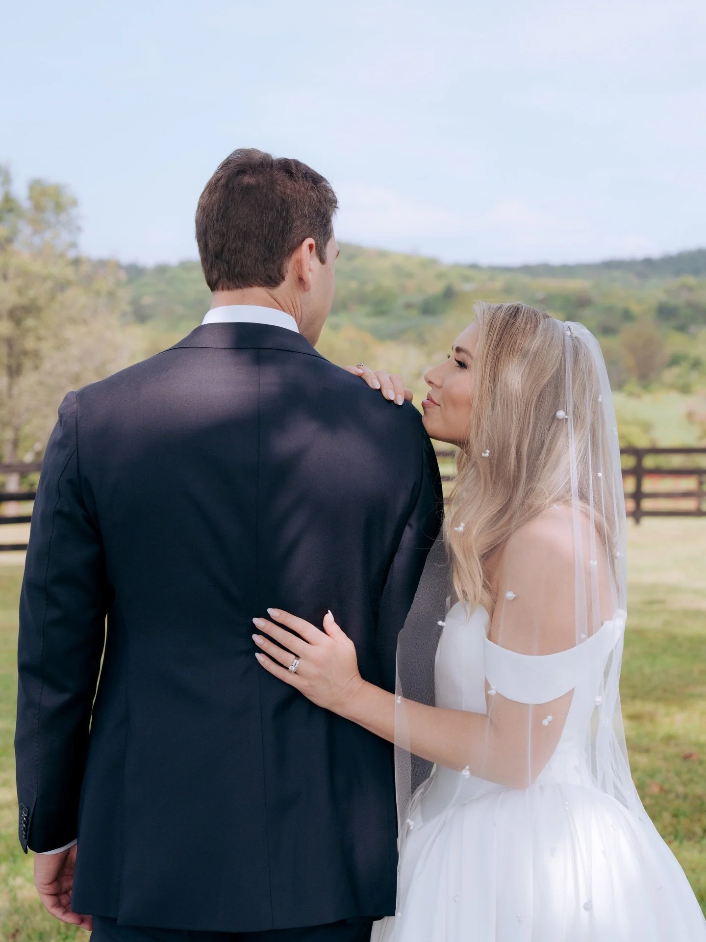 L+M&rsquo;s day unfolded with an ease that felt almost luminous - soft hills stretching behind them, tender glances exchanged beneath a quiet veil, and details that spoke gently of who they are together. 

From the florals brushing against the aftern