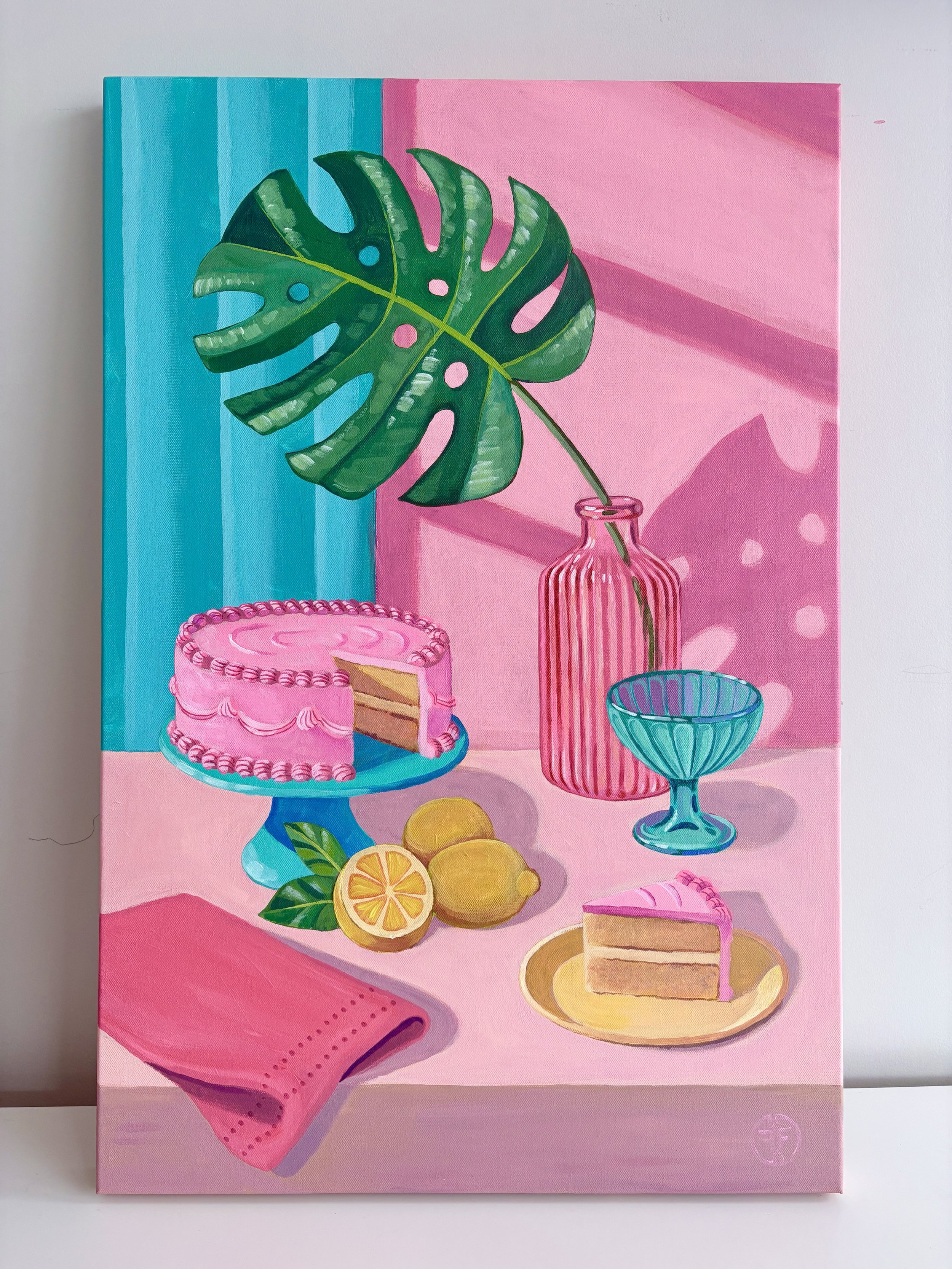 Painting of a pink cake with white frosting on a teal cake stand, lemon slices and greenery, and pink and teal tableware on a pink background.