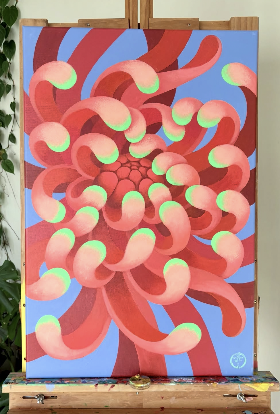 Abstract painting featuring swirling pink and red tentacle-like shapes with green tips on a blue background.