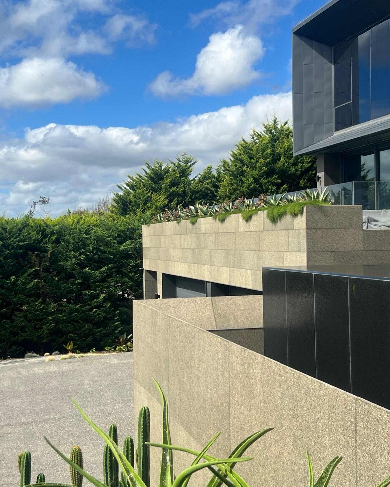 Architecture&hellip; bold&hellip; grounded&hellip; unapologetic&hellip;

But what I love most is what softens it&hellip; what lets it breathe&hellip; 🌿

Those layered ribbons of living foliage&hellip; succulents&hellip; cacti&hellip; spilling gently