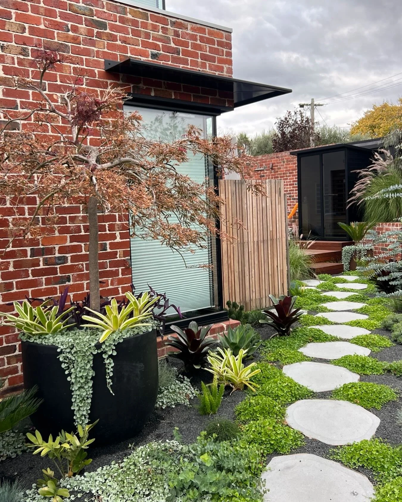 Three months in&hellip; and already speaking volumes 🌿

This little pocket for Russell &amp; Michelle is exactly what happens when architecture and landscape start dancing together instead of competing&hellip; brick, steel, timber&hellip; softened a