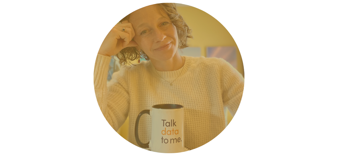 Burnout recovery coach smiling with mug saying 'Talk data to me'