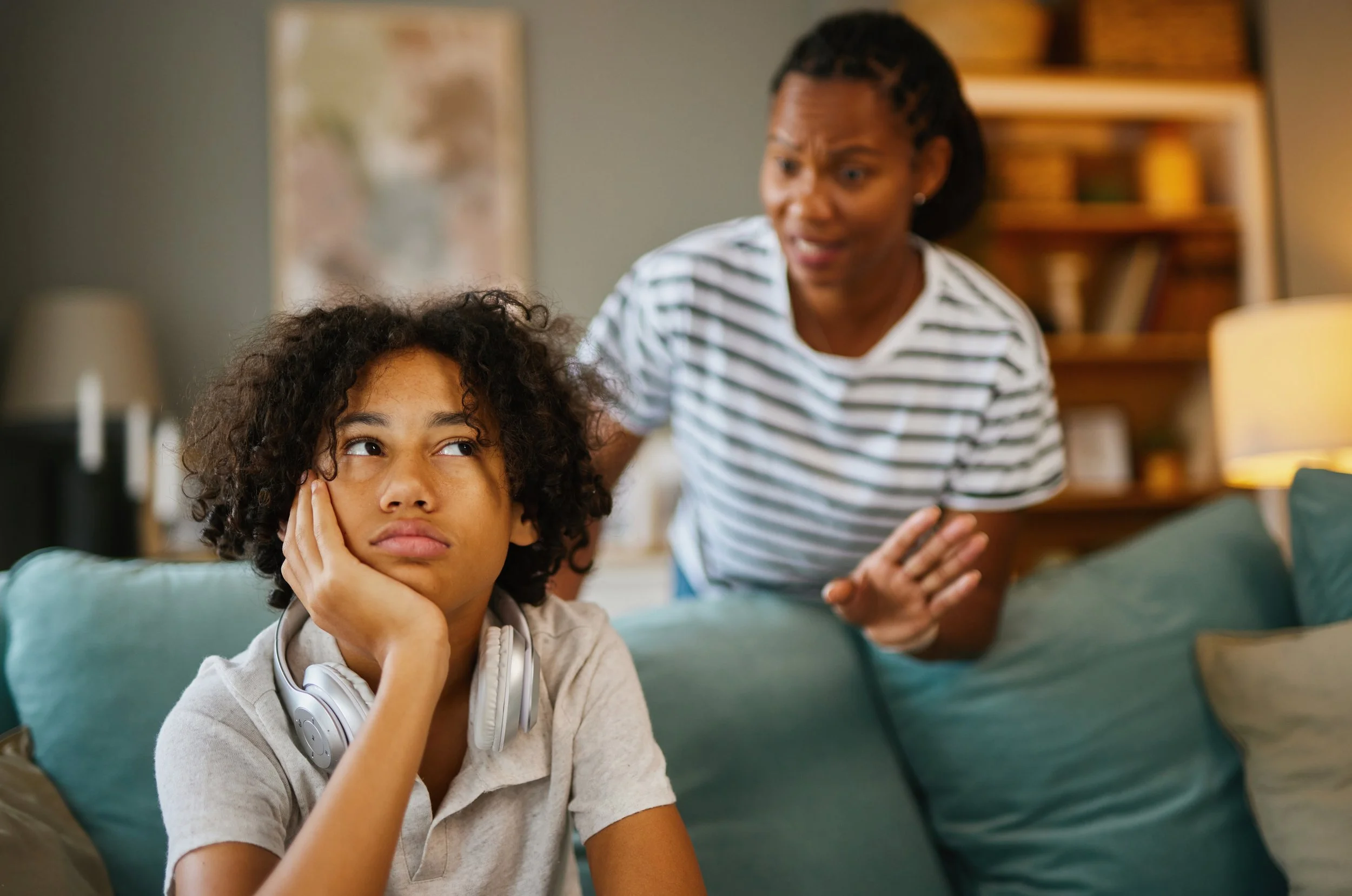 Parent speaking to frustrated tween at home during after-school meltdowns following a long school day.