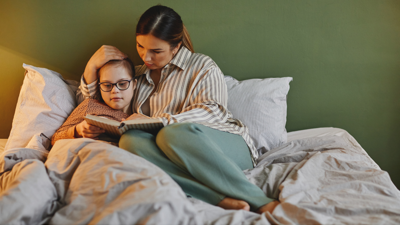 Mom and child reading in bed