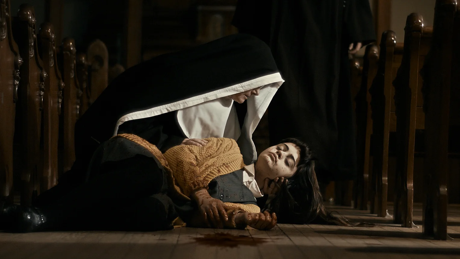 The Book of Birdie scene - Nun holding Birdie in church