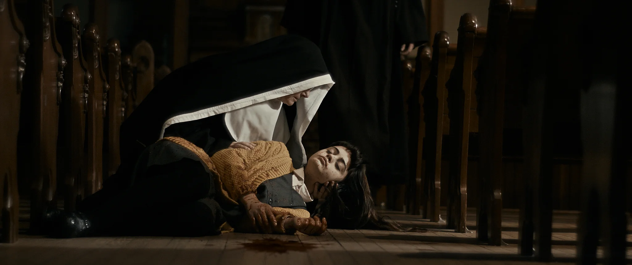 The Book of Birdie - Nun holding Birdie in church