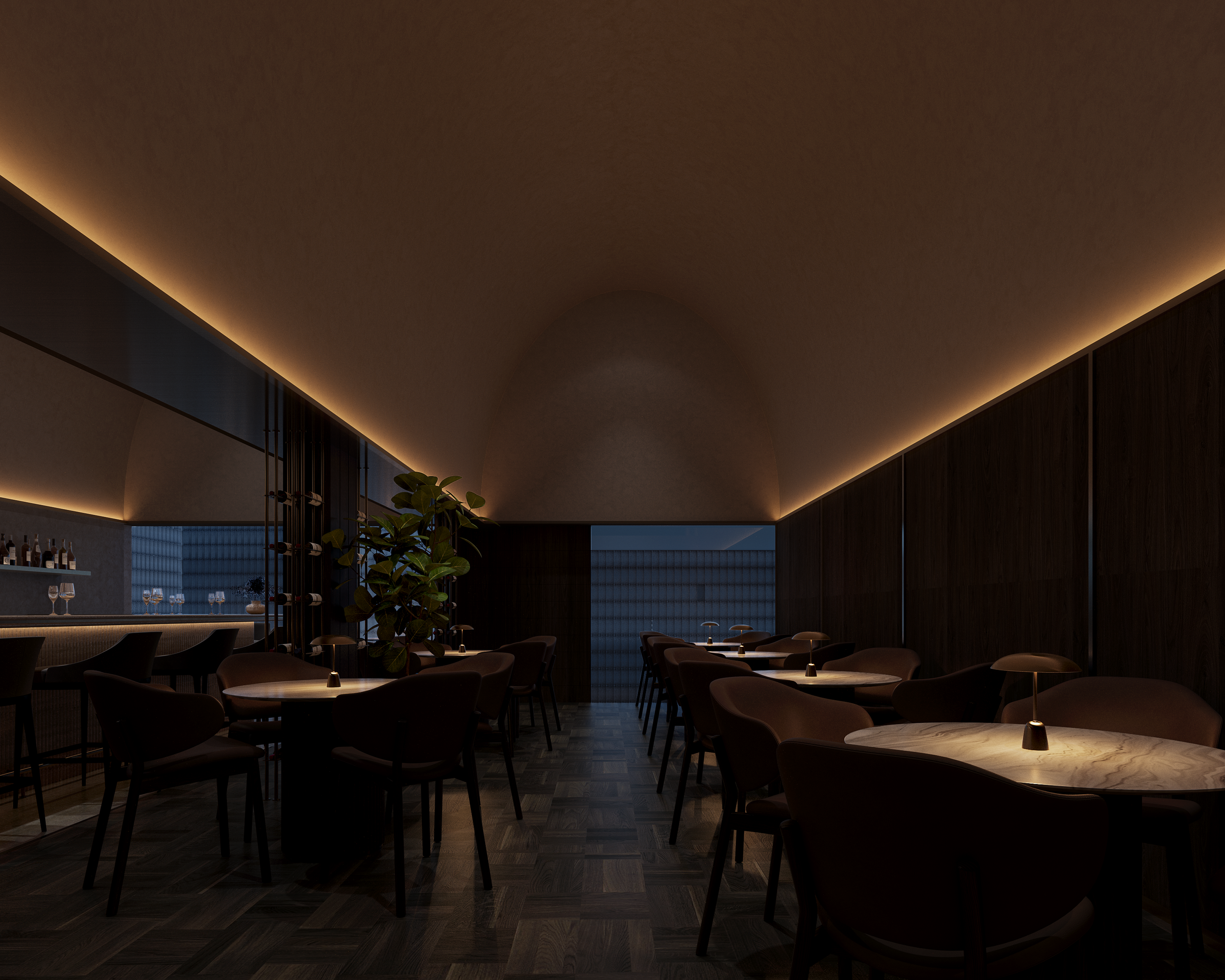 Dimly lit modern restaurant with round tables, dark chairs, and warm ambient lighting along the ceiling.